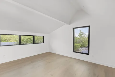 an empty room with large window
