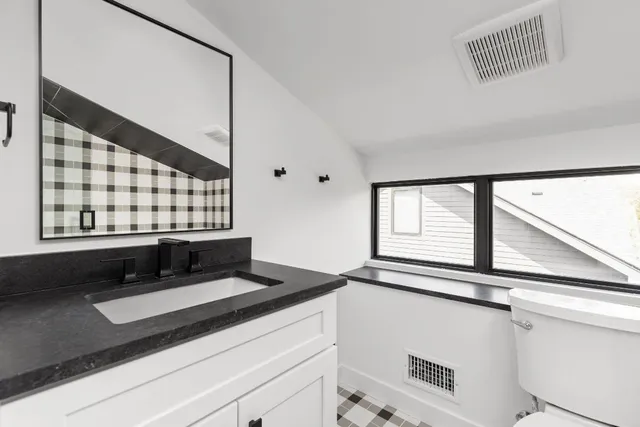 a kitchen with a sink and a window