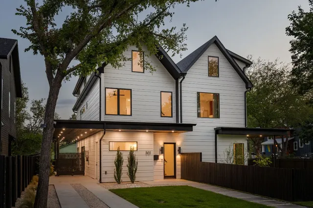a front view of a house with garage
