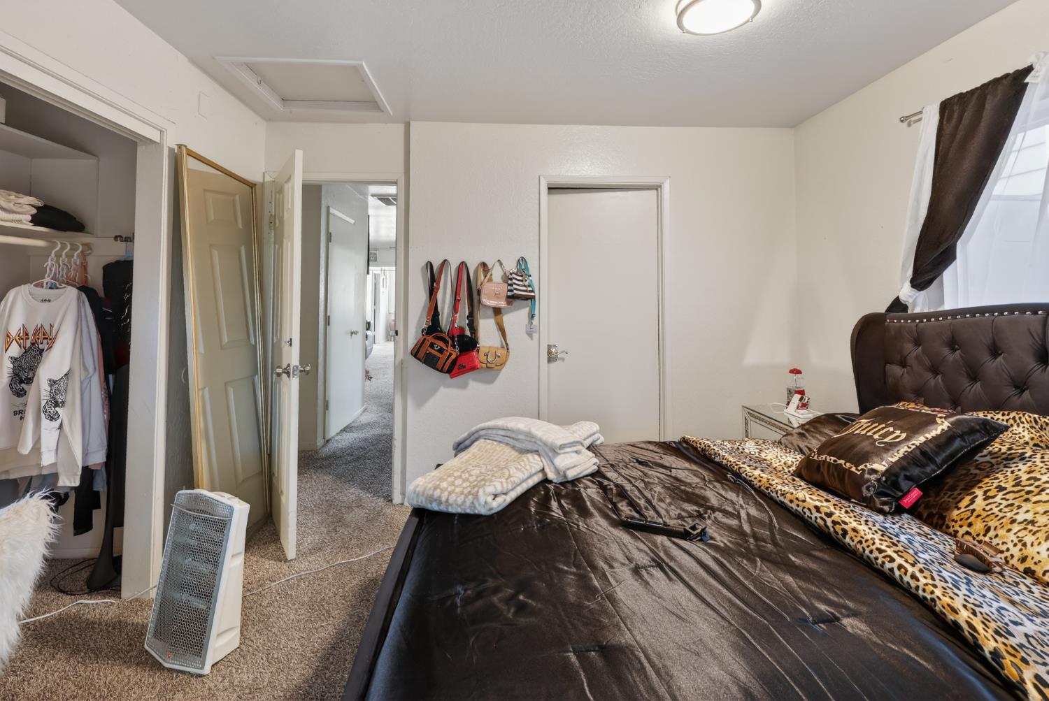 628 Olive Street Sonora, CA 95370 - Photo 16 of 46 a bedroom with a bed and a couch