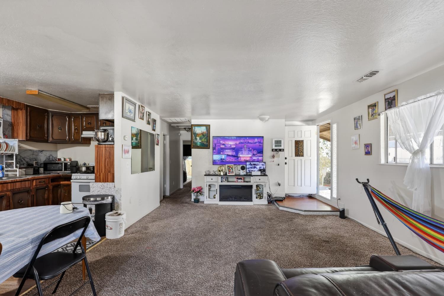628 Olive Street Sonora, CA 95370 - Photo 6 of 46 a living room with furniture and a flat screen tv