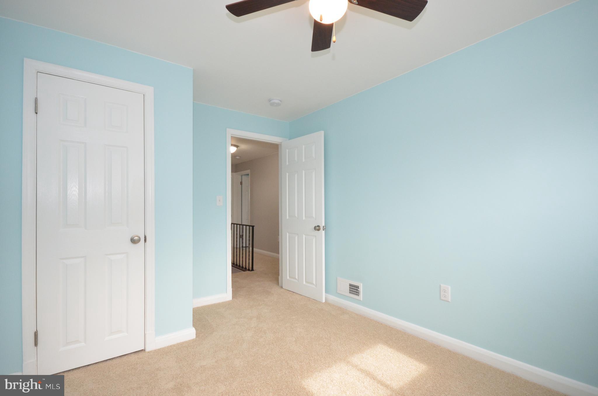 1318 Glendale Road Baltimore, MD 21239 - Photo 22 of 30 an empty room with a empty space and a ceiling fan