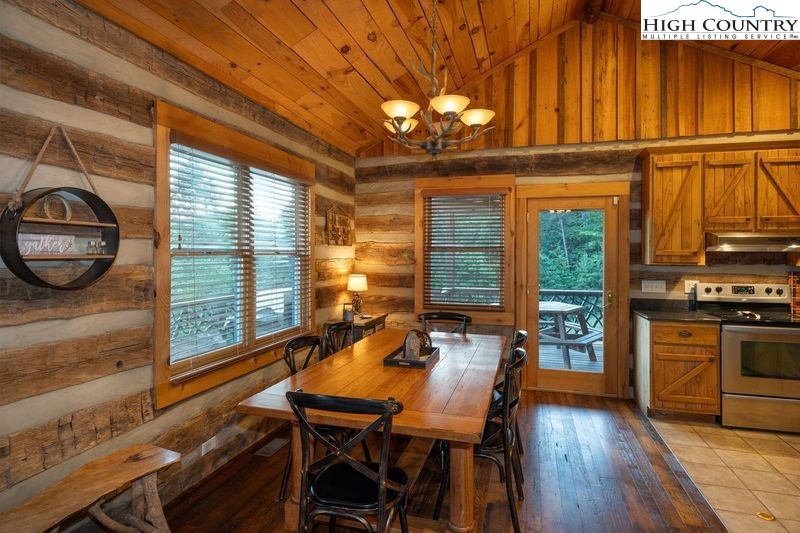 546 Big Sky Road Ferguson, NC 28624 - Photo 11 of 23 a view of a dining room with furniture window and wooden floor