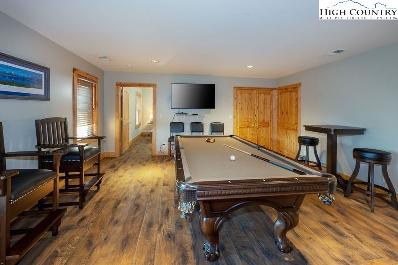 546 Big Sky Road Ferguson, NC 28624 - Photo 14 of 23 a room with furniture pool table flat screen tv and windows