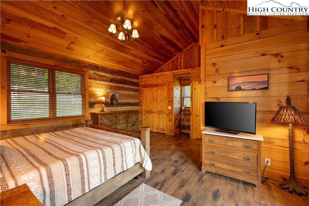 546 Big Sky Road Ferguson, NC 28624 - Photo 18 of 23 a bedroom with a bed and a flat screen tv