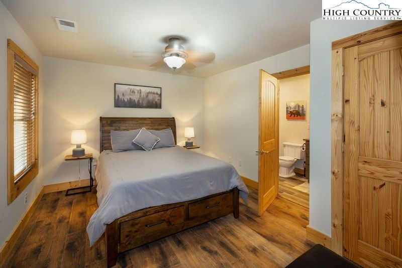 546 Big Sky Road Ferguson, NC 28624 - Photo 20 of 23 a bedroom with a bed and a painting on the wall