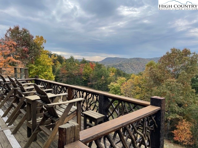 546 Big Sky Road Ferguson, NC 28624 - Photo 22 of 23 a view of a roof deck with mountain view and wooden floor
