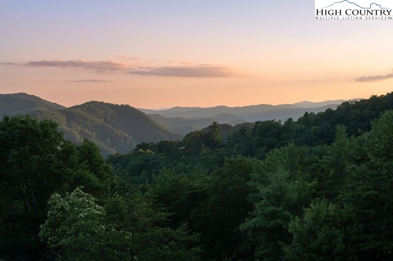 546 Big Sky Road Ferguson, NC 28624 - Photo 7 of 23 a view of a mountain in the distance in a field