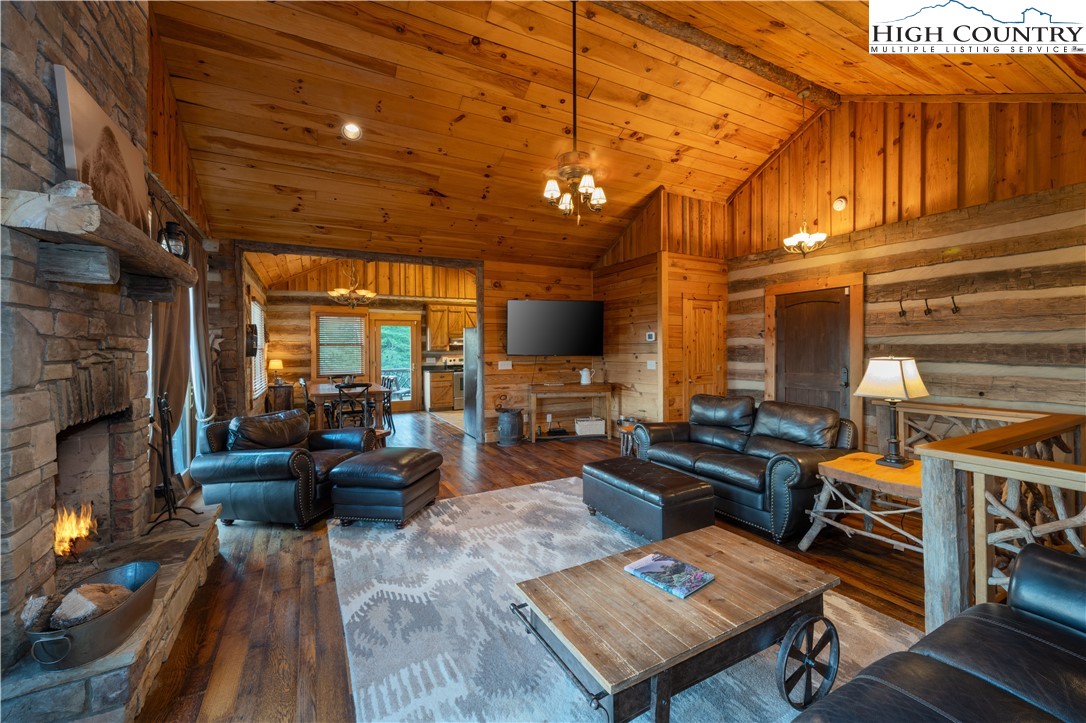 546 Big Sky Road Ferguson, NC 28624 - Photo 9 of 23 a living room with furniture and a fireplace