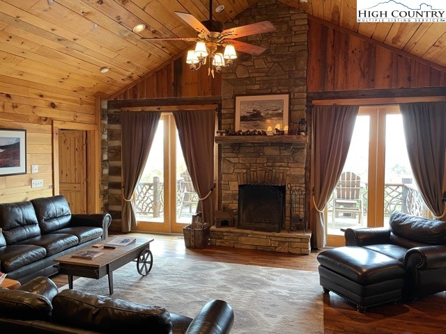 546 Big Sky Road Ferguson, NC 28624 - Photo 10 of 23 a living room with furniture a fireplace and a flat screen tv