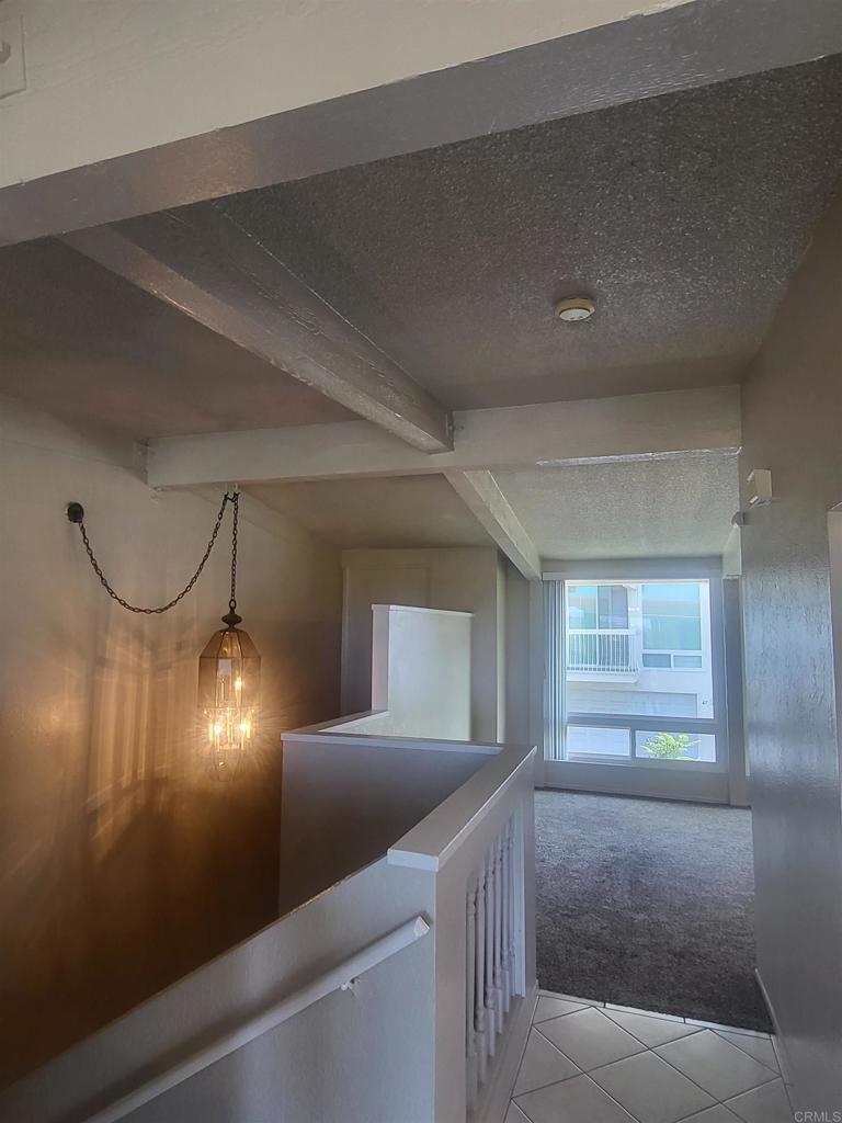 2319 Caringa Way, Unit 56 Carlsbad, CA 92009 - Photo 14 of 24 a view of an empty room and window