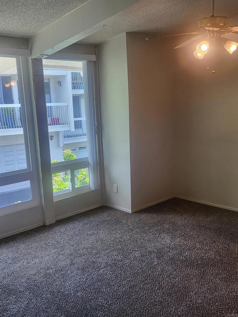 2319 Caringa Way, Unit 56 Carlsbad, CA 92009 - Photo 15 of 24 a view of an empty room with a window