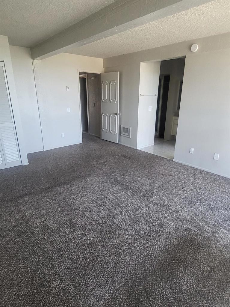 2319 Caringa Way, Unit 56 Carlsbad, CA 92009 - Photo 16 of 24 a view of a big room with closet and mirror