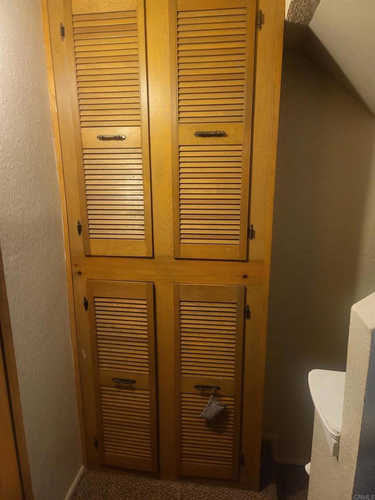 2319 Caringa Way, Unit 56 Carlsbad, CA 92009 - Photo 22 of 24 a bathroom with a shower and a toilet