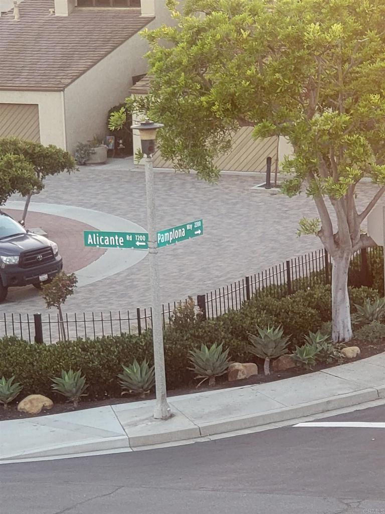 2319 Caringa Way, Unit 56 Carlsbad, CA 92009 - Photo 24 of 24 a view of a brick house next to a road