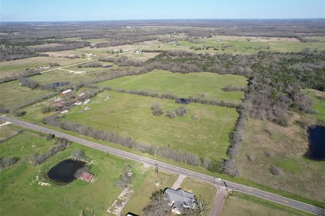 a view of a garden with a building in the background