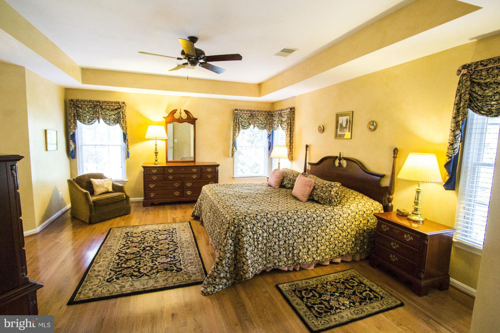 1827 Beulah Road Vienna, VA 22182 - Photo 16 of 30 a bedroom with a bed and wooden floor