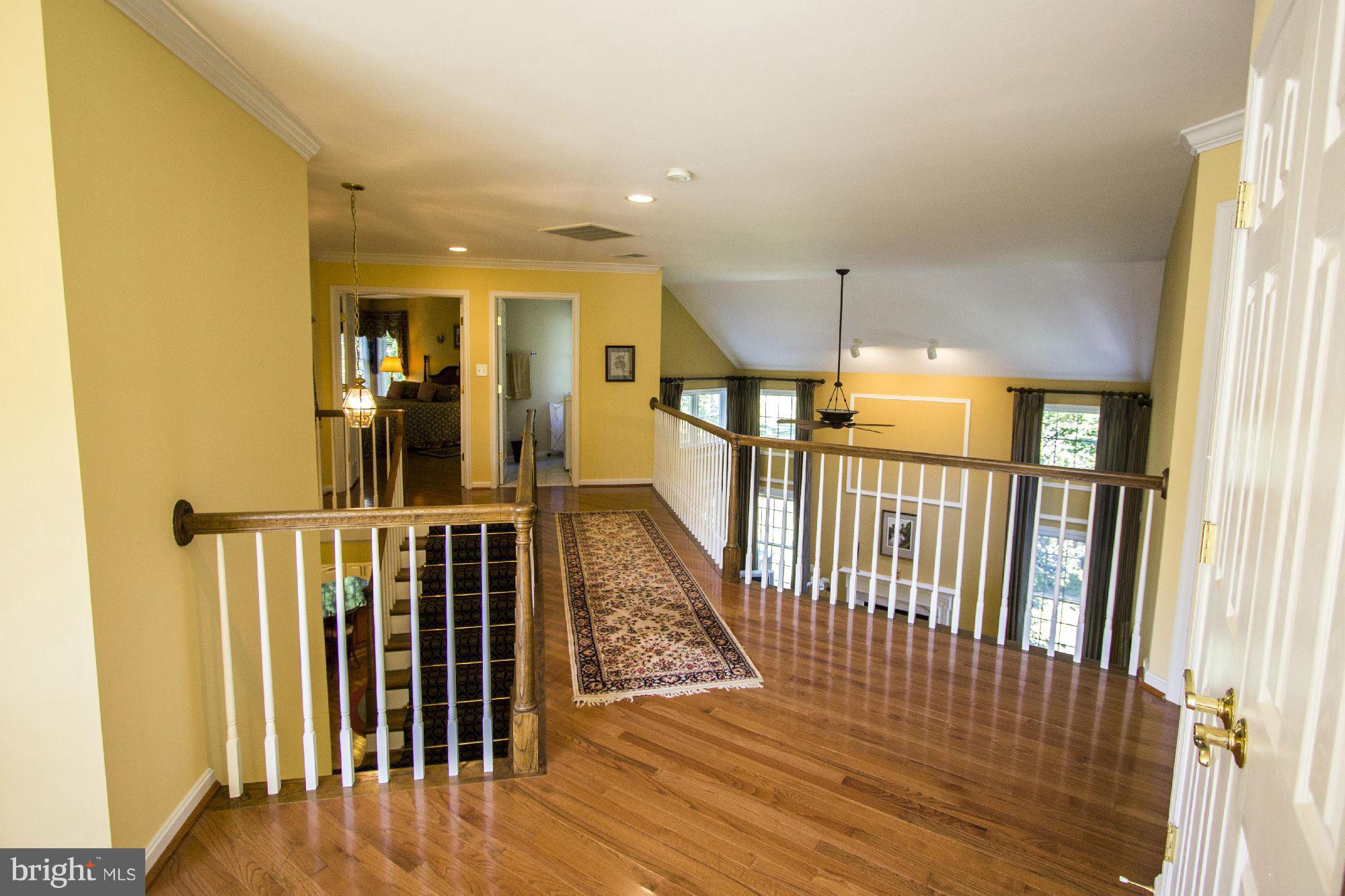 1827 Beulah Road Vienna, VA 22182 - Photo 19 of 30 a view of a hallway with wooden floor and entryway