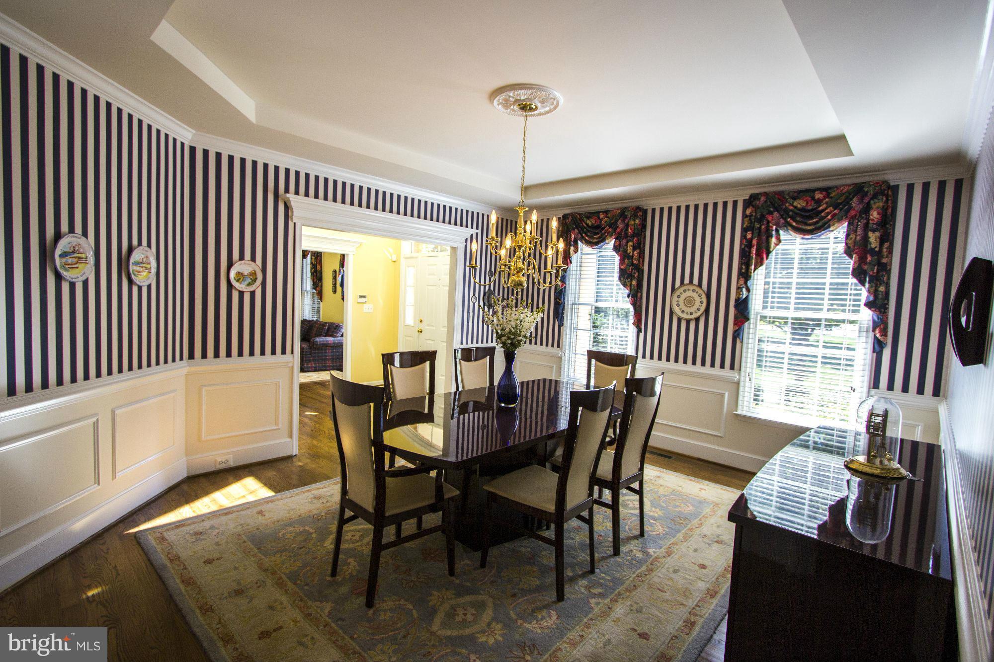 1827 Beulah Road Vienna, VA 22182 - Photo 5 of 30 a view of a dining room with furniture window and wooden floor