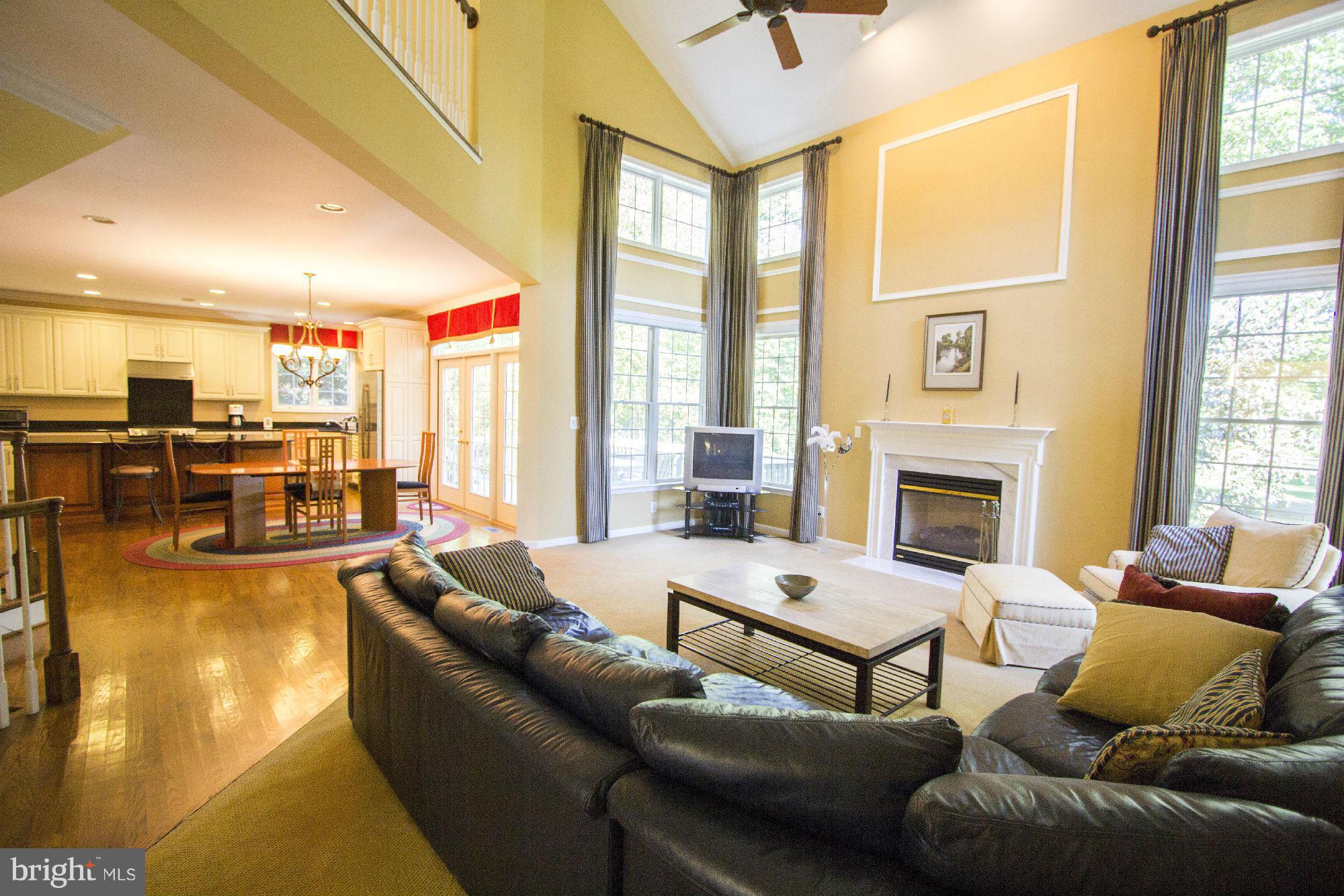 1827 Beulah Road Vienna, VA 22182 - Photo 8 of 30 a living room with furniture fireplace and a large window