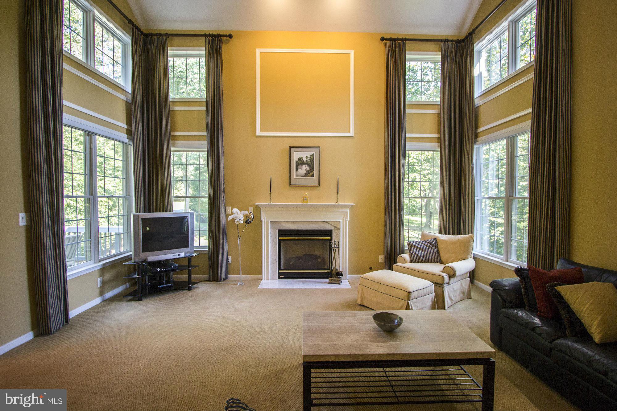 1827 Beulah Road Vienna, VA 22182 - Photo 9 of 30 a living room with furniture and a fireplace
