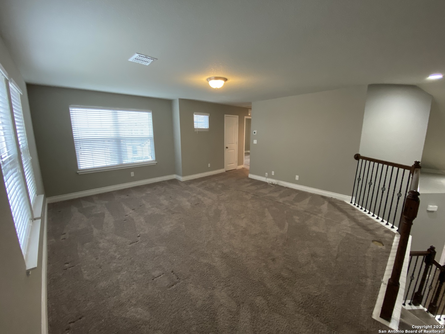 27447 Rio Circle Boerne, TX 78015 - Photo 11 of 18 en empty room with windows
