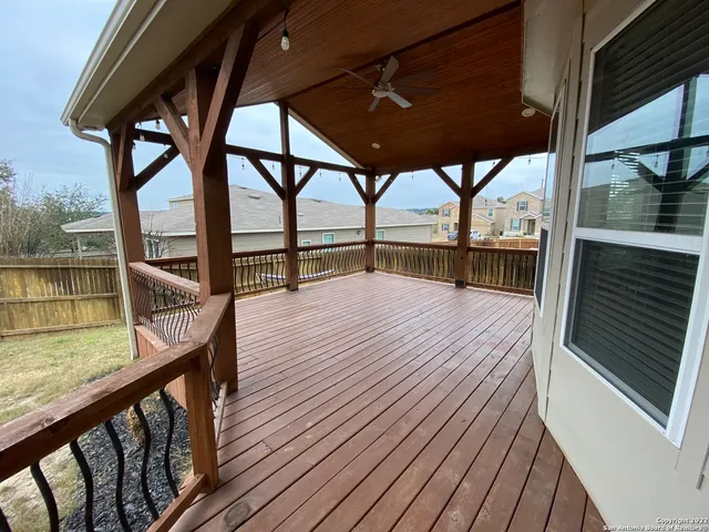 a view of balcony with wooden floor