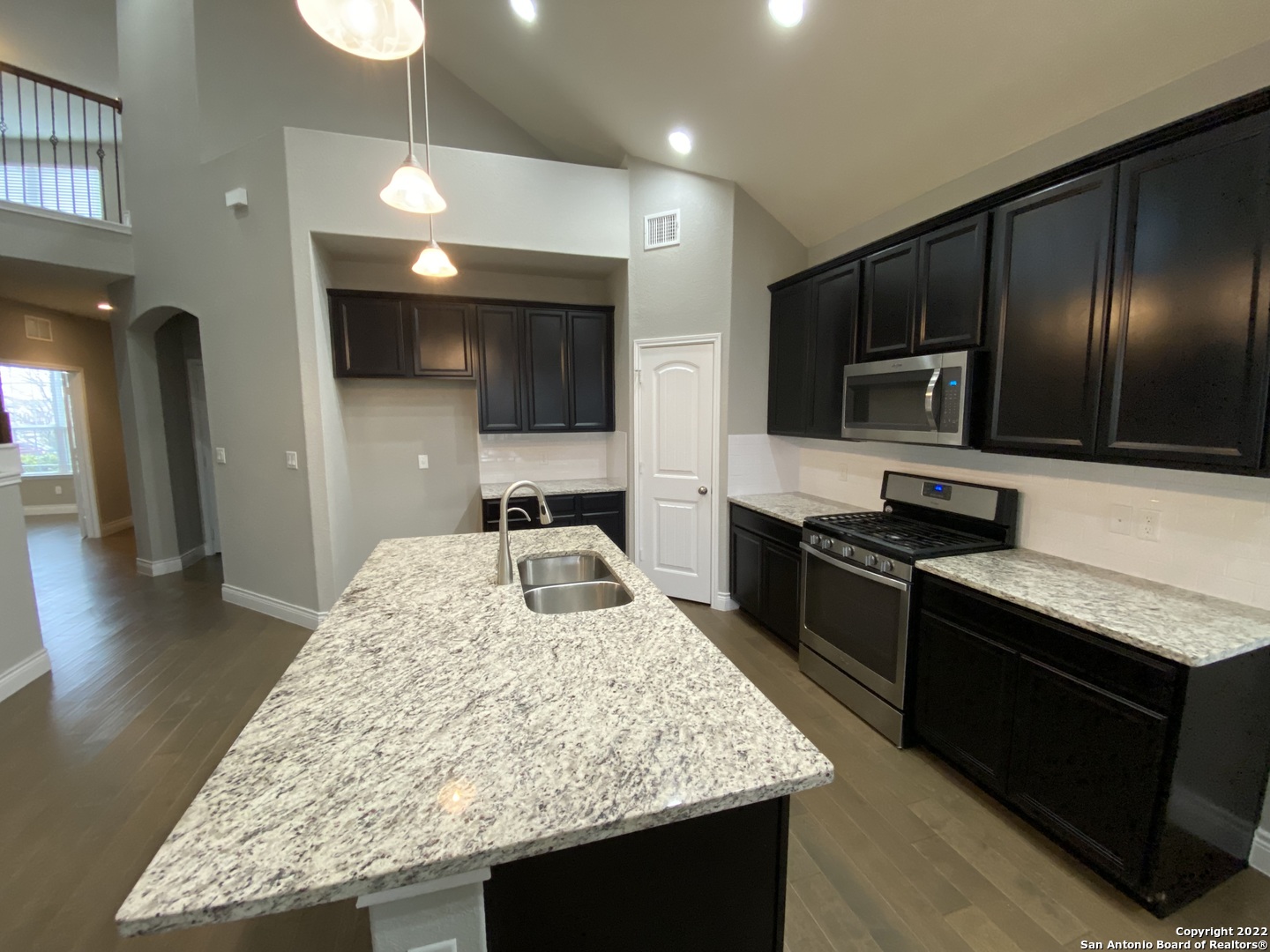 27447 Rio Circle Boerne, TX 78015 - Photo 3 of 18 a kitchen with a sink stove and refrigerator