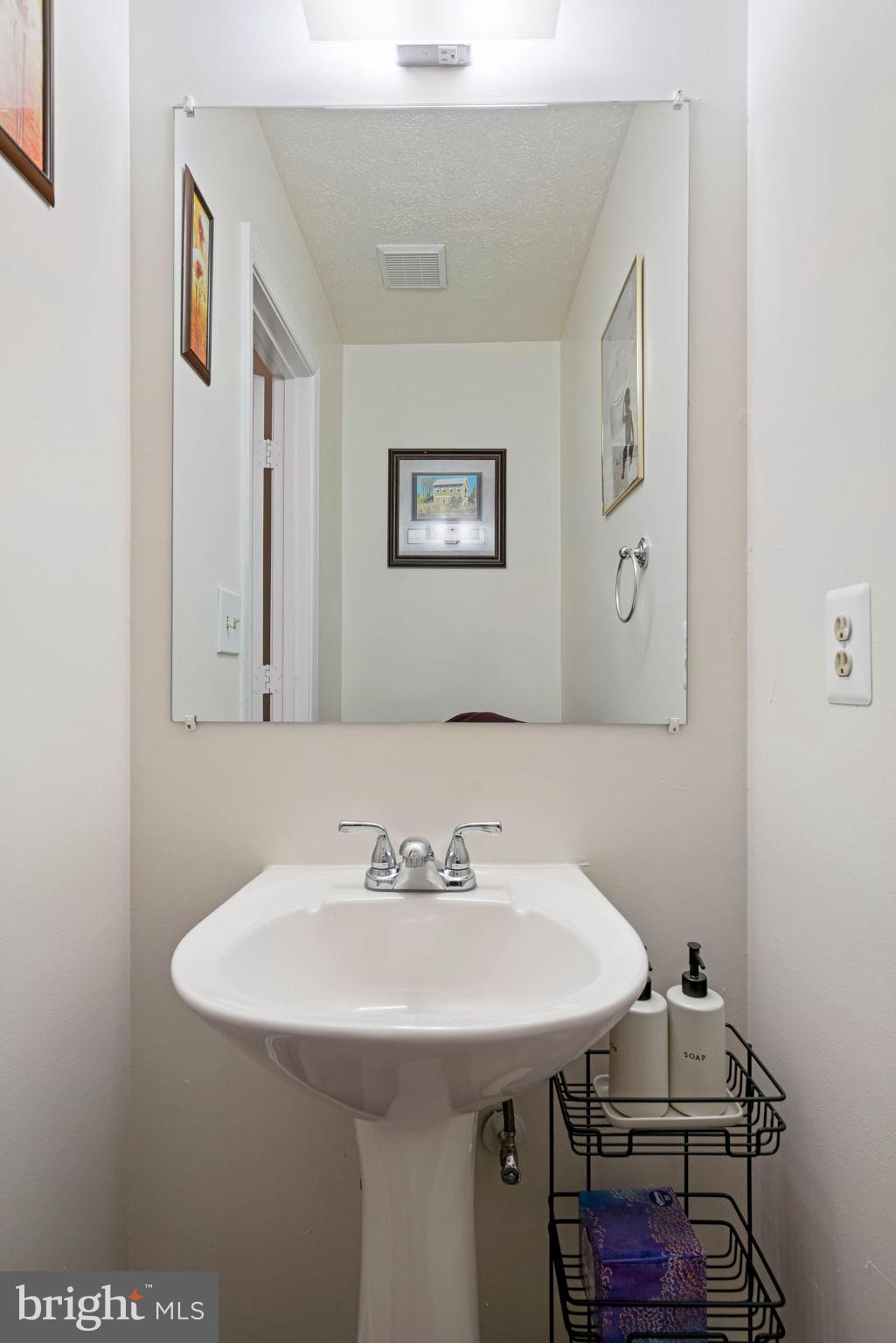 407 Kings Crest Drive Stafford, VA 22554 - Photo 13 of 42 a bathroom with a sink and a mirror