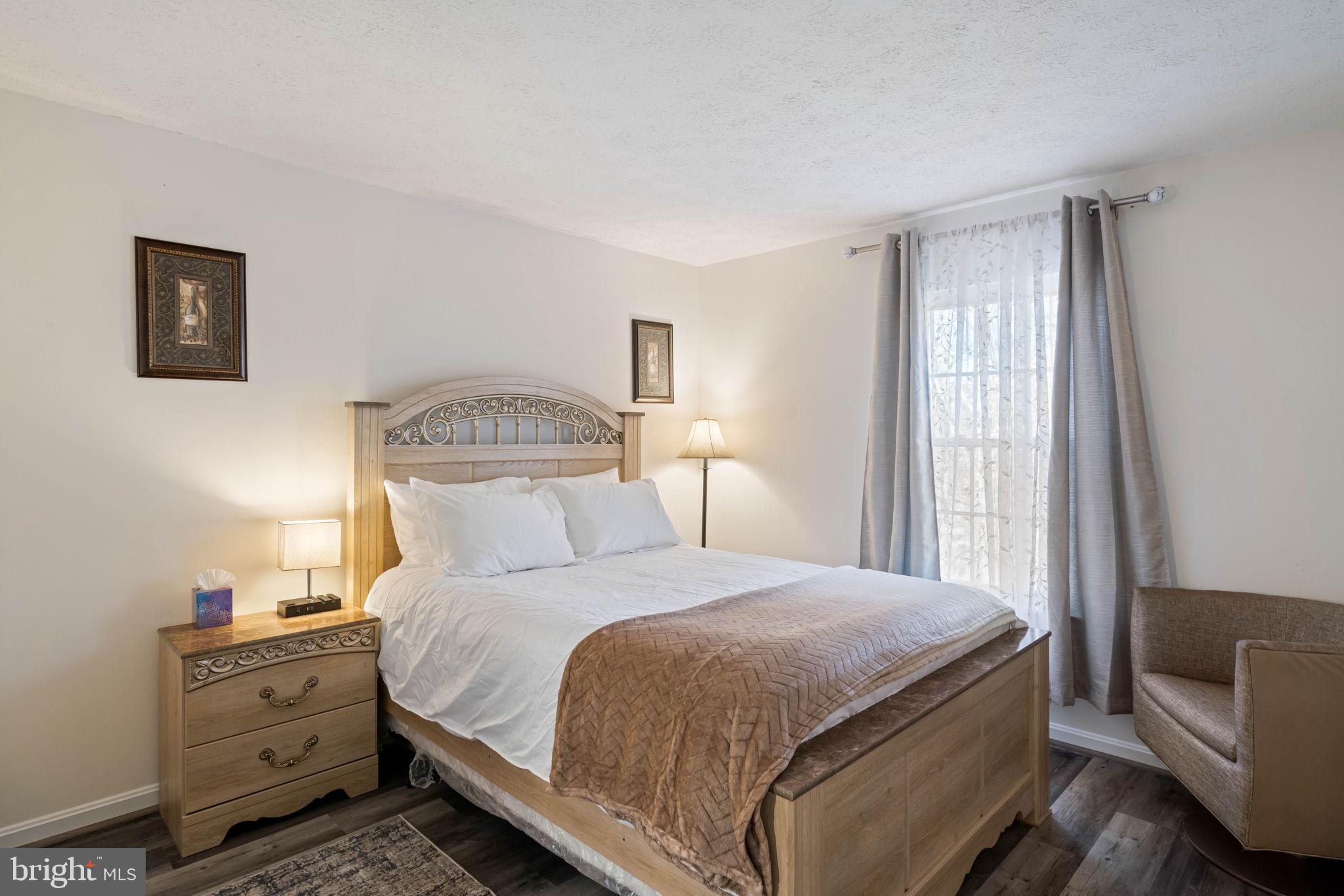 407 Kings Crest Drive Stafford, VA 22554 - Photo 19 of 42 a bedroom with a bed and a couch