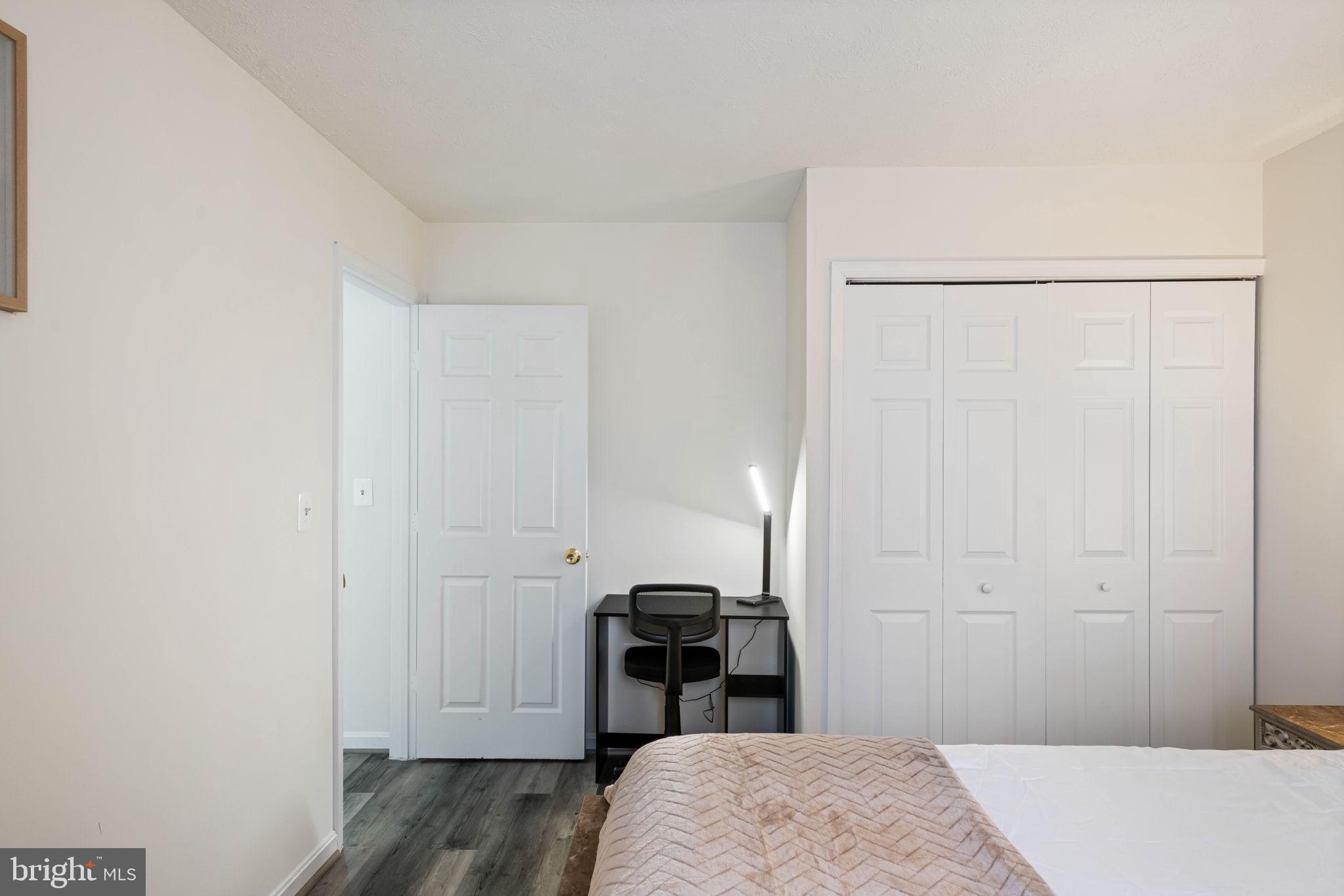 407 Kings Crest Drive Stafford, VA 22554 - Photo 20 of 42 a bedroom with a bed and a table in it