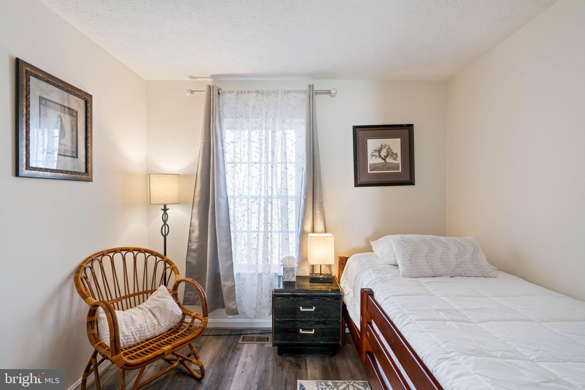 407 Kings Crest Drive Stafford, VA 22554 - Photo 21 of 42 a bedroom with a bed and wooden floor