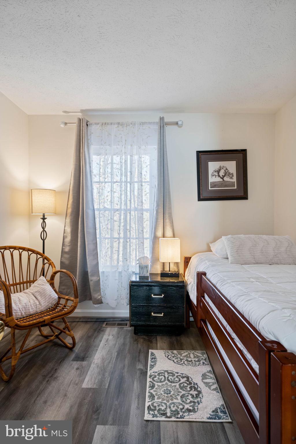 407 Kings Crest Drive Stafford, VA 22554 - Photo 23 of 42 a bedroom with a bed and a window