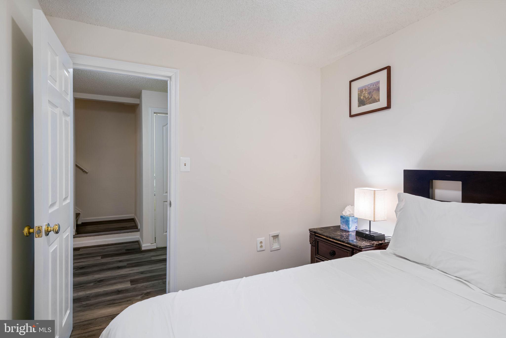 407 Kings Crest Drive Stafford, VA 22554 - Photo 27 of 42 a bedroom with a bed and wooden floor