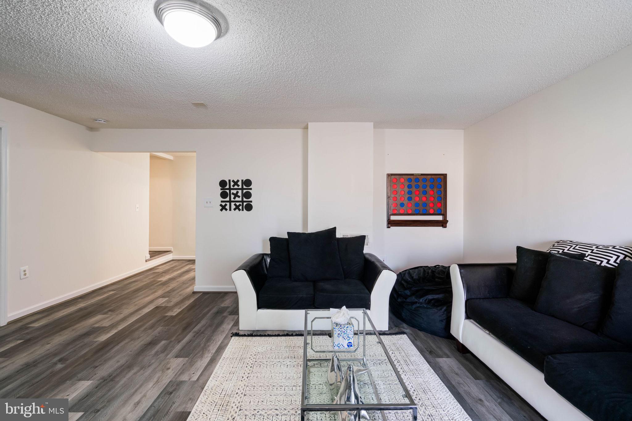 407 Kings Crest Drive Stafford, VA 22554 - Photo 30 of 42 a living room with furniture and a rug