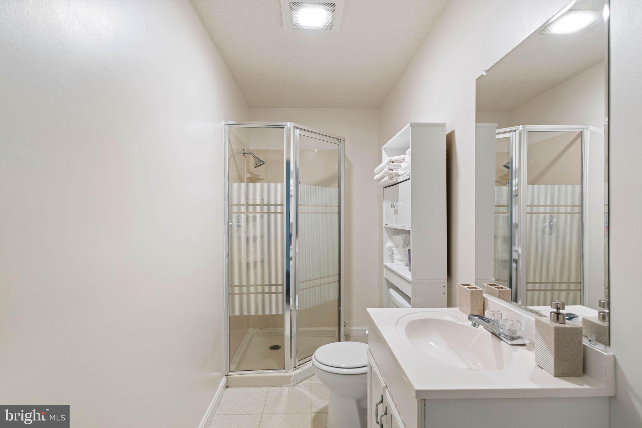 407 Kings Crest Drive Stafford, VA 22554 - Photo 33 of 42 a bathroom with a sink toilet and shower