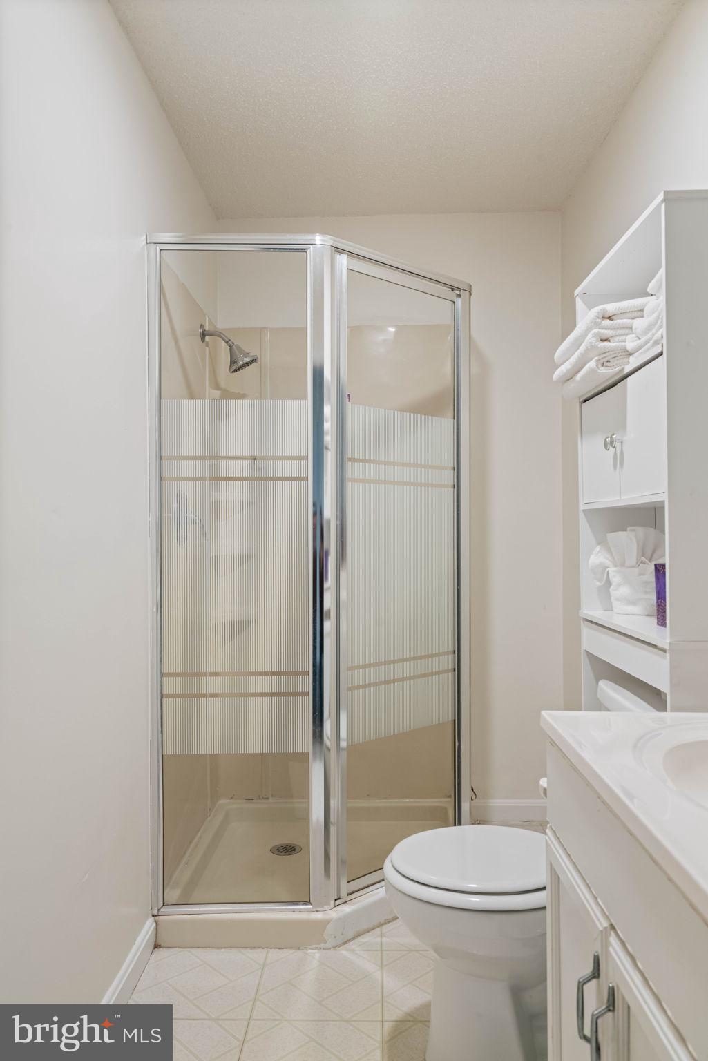 407 Kings Crest Drive Stafford, VA 22554 - Photo 34 of 42 a bathroom with a shower a toilet and a sink