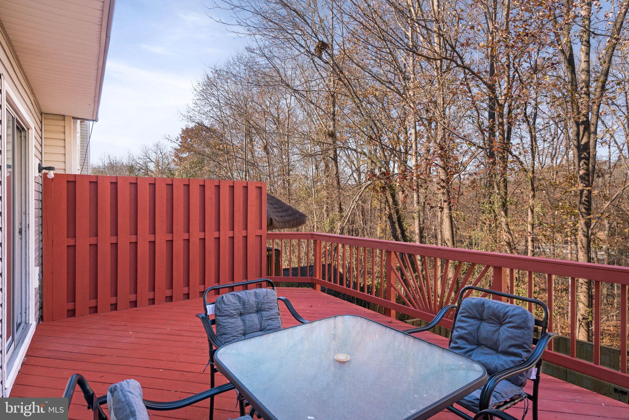 407 Kings Crest Drive Stafford, VA 22554 - Photo 41 of 42 a balcony with wooden floor table and chairs