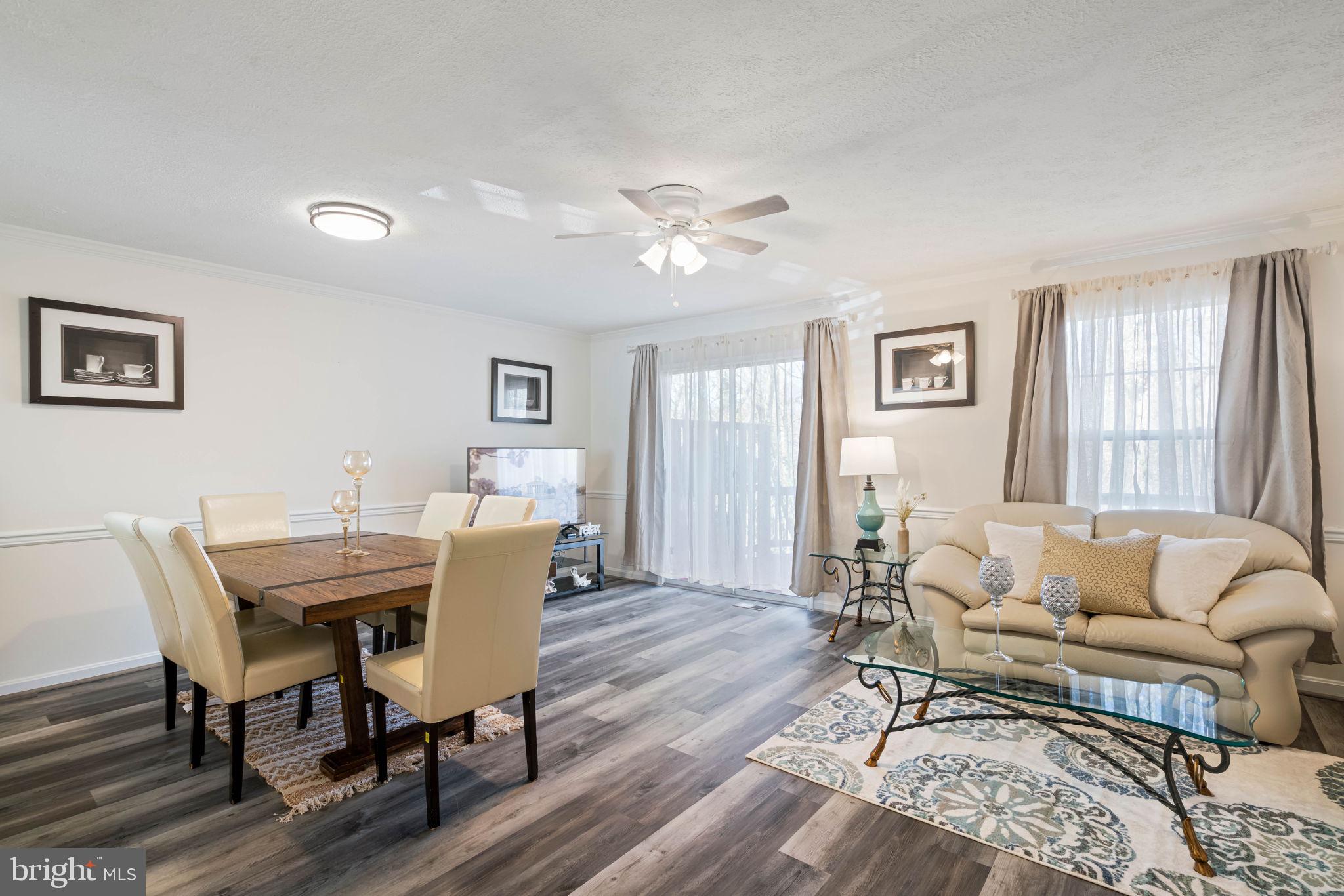 407 Kings Crest Drive Stafford, VA 22554 - Photo 5 of 42 a view of a dining room with furniture and wooden floor