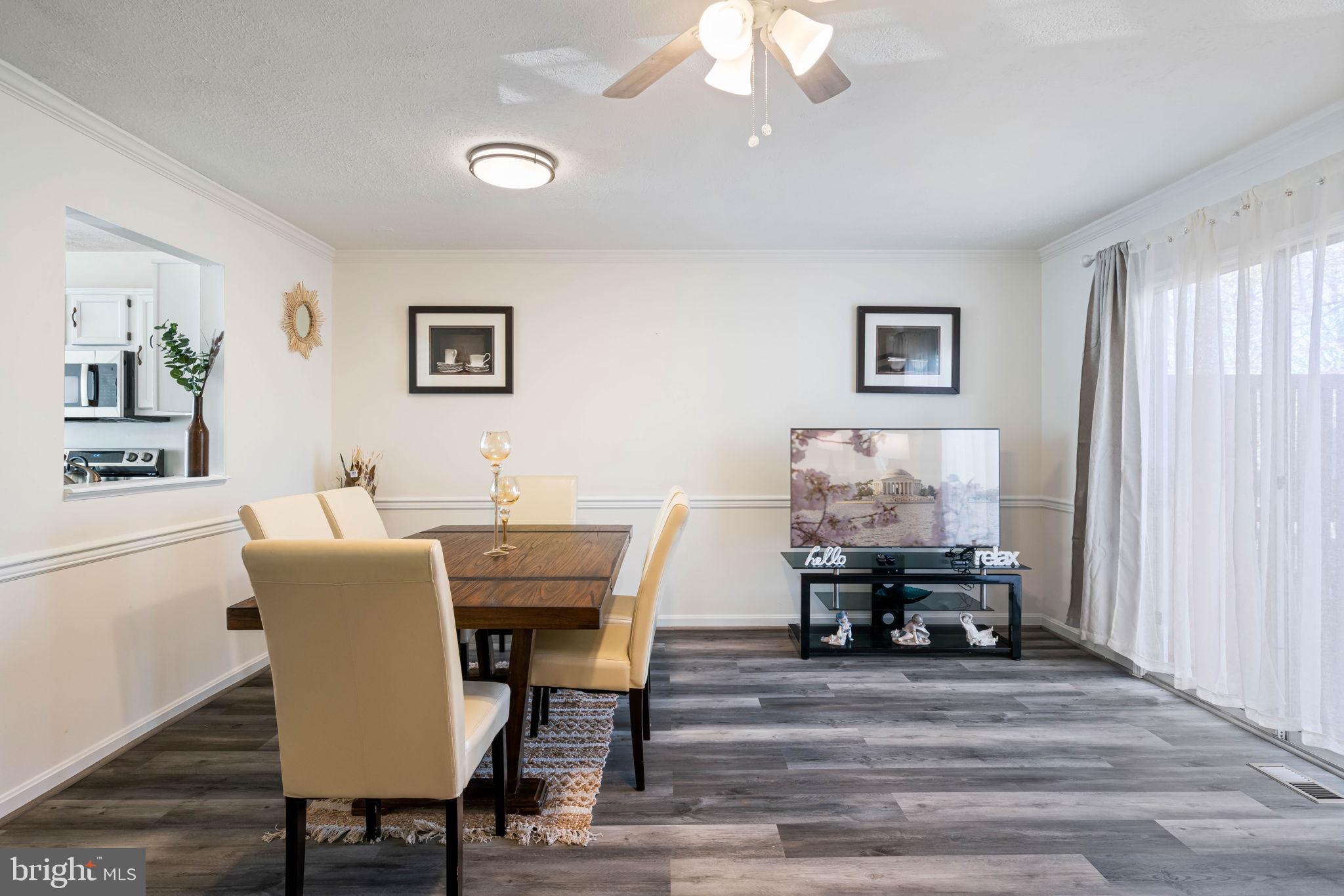 407 Kings Crest Drive Stafford, VA 22554 - Photo 6 of 42 a view of a dining room with furniture and wooden floor