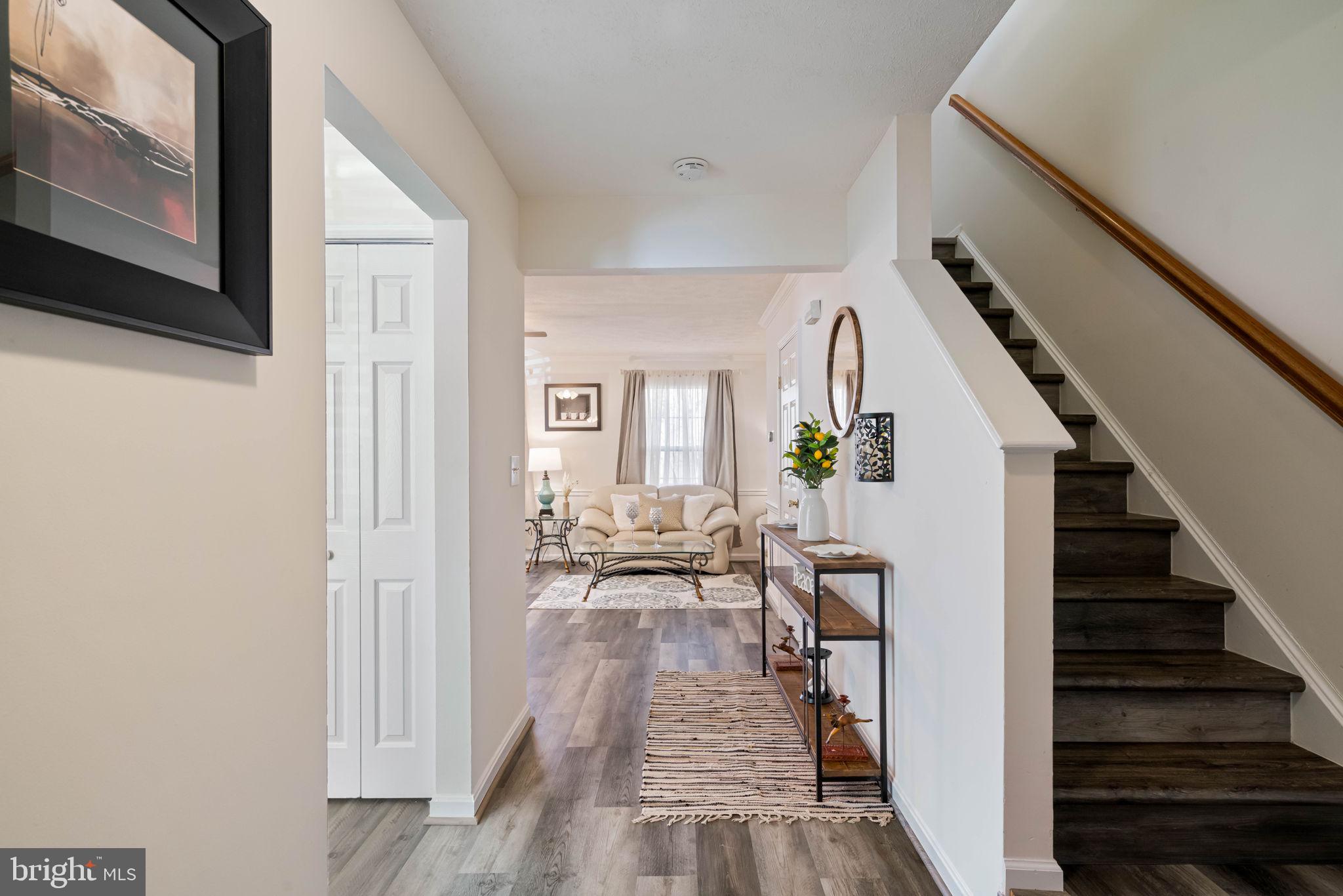 407 Kings Crest Drive Stafford, VA 22554 - Photo 7 of 42 a view of an entryway with wooden floor and a livingroom view