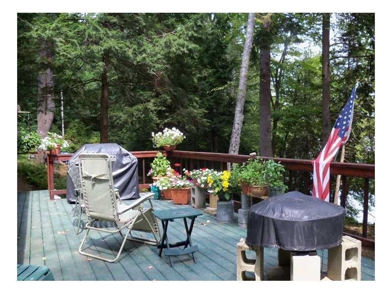 76 Vienna Shores Road Vienna, ME 04360 - Photo 5 of 12 Enjoy the outdoors on your deck.