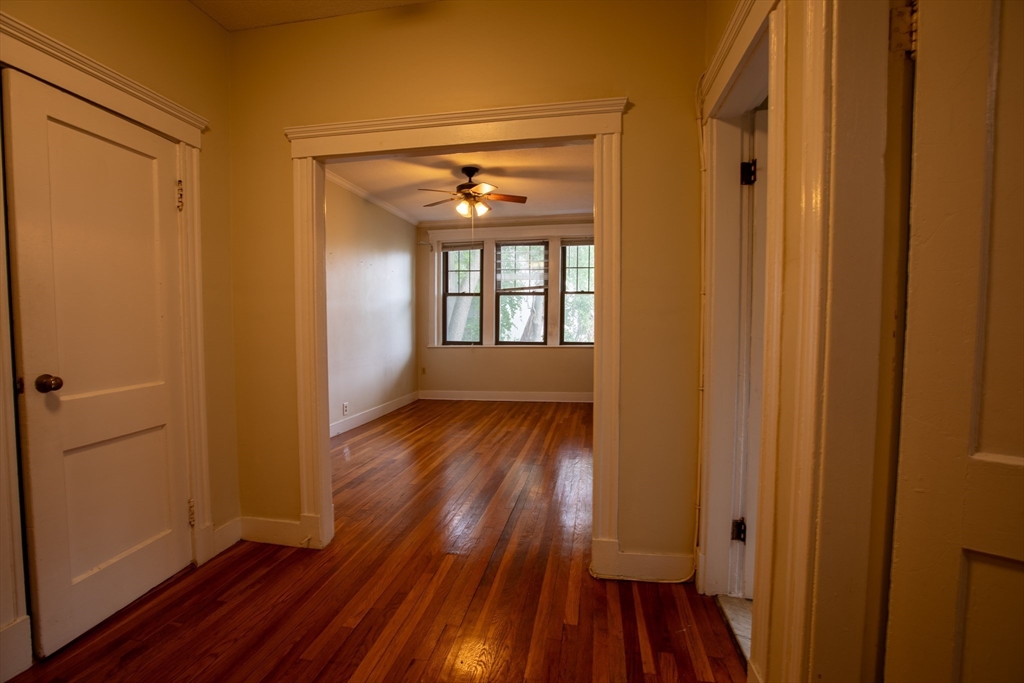 153 Strathmore Road, Unit 4 Boston, MA 02135 - Photo 7 of 9 a view of entryway with wooden floor