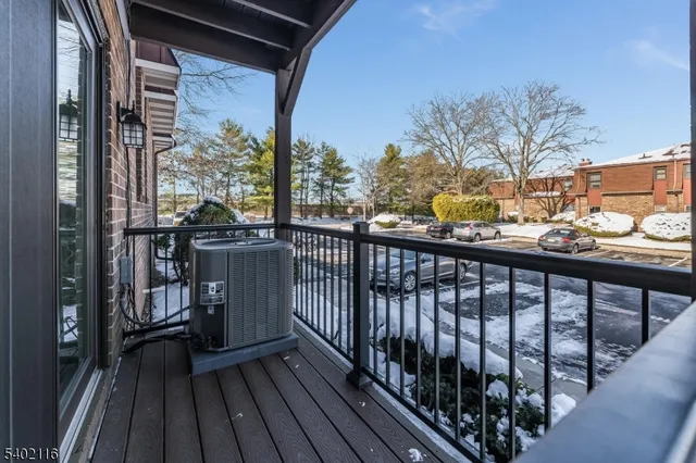 a view of balcony with wooden floor
