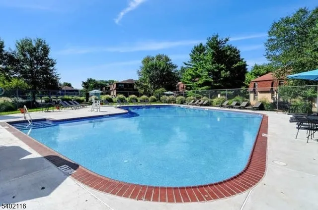 a view of a swimming pool with a lounge chairs