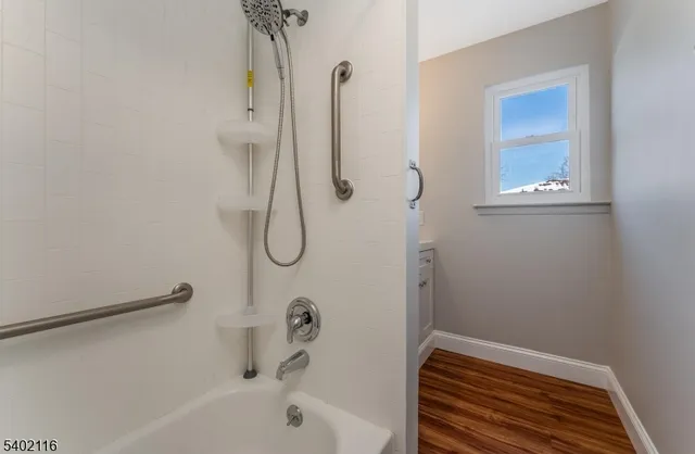 a bathroom with a bath tub and a shower