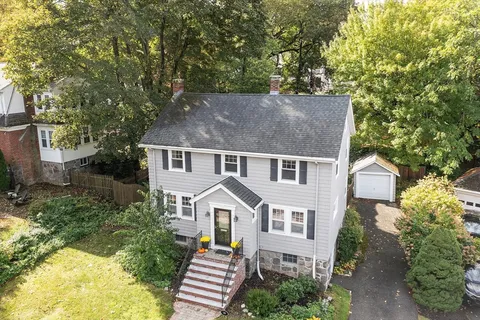 front view of a house with a yard