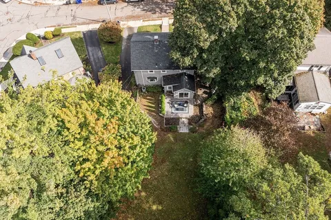 an aerial view of residential house with outdoor space