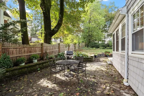 a view of a bench in a backyard