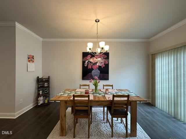 517 Flat Ford Road Hillsborough, NC 27278 - Photo 11 of 27 a view of a dining room with furniture wooden floor and a chandelier